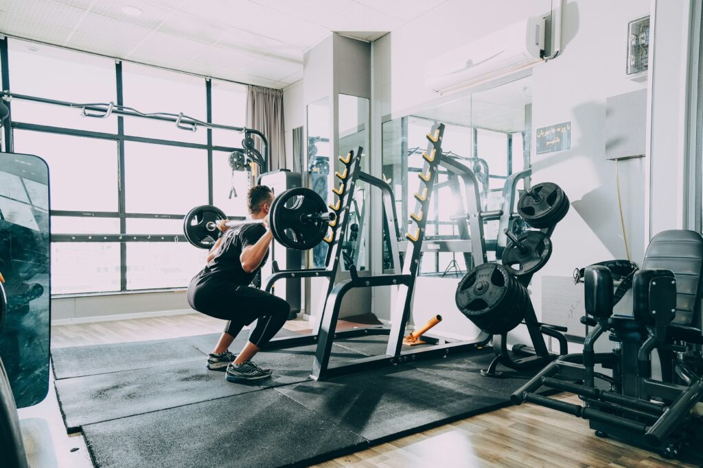 Person doing squats at the gym