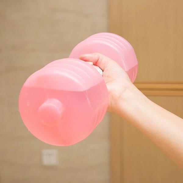 Pink water dumbbell in someones hand